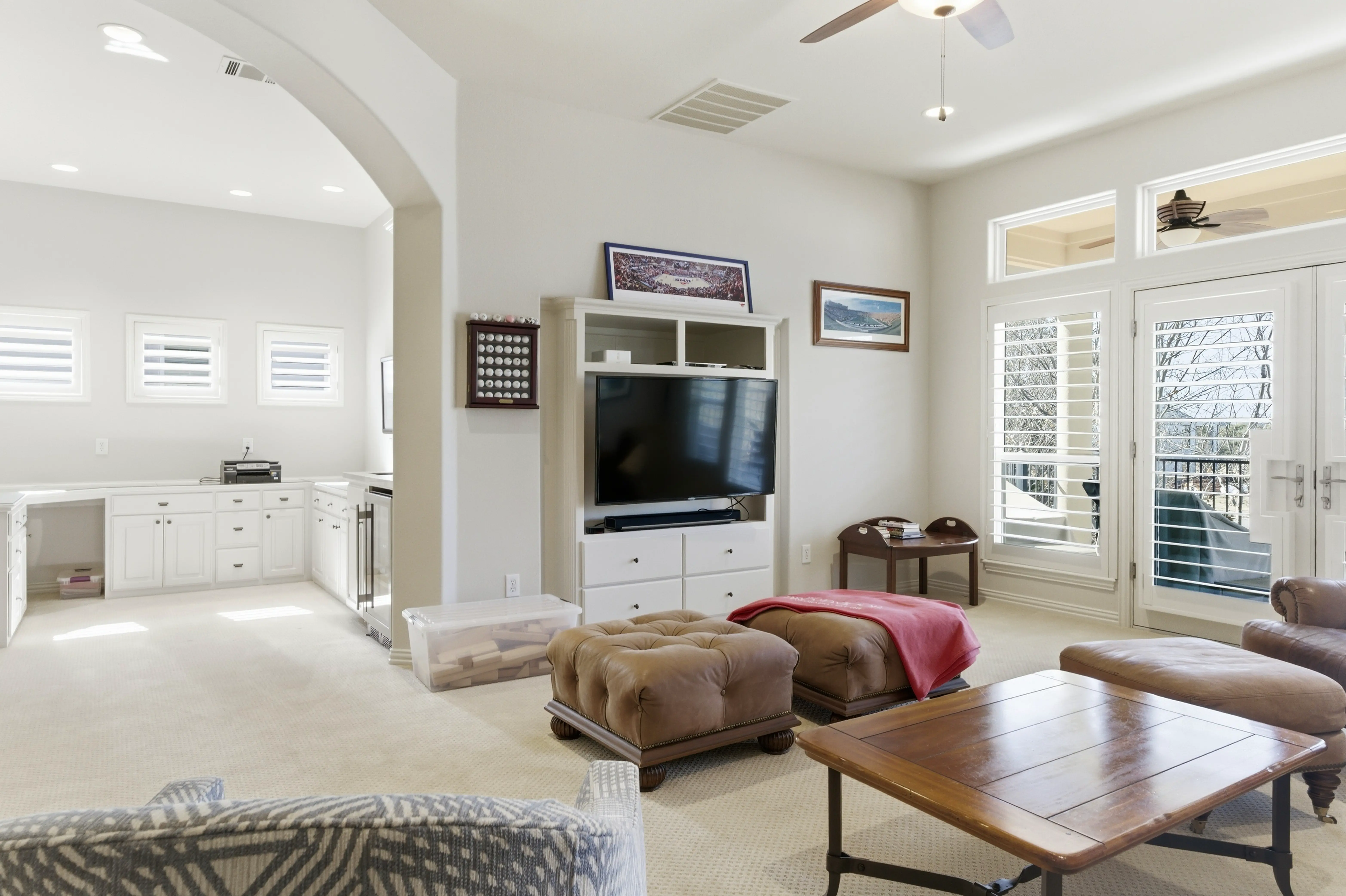 Upstairs bonus living room with built-in media center and cabinetry